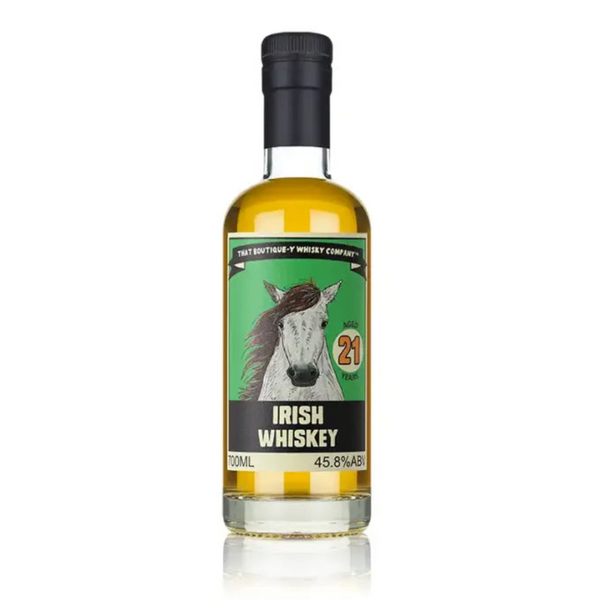 Bottle of That Boutique-y Whisky Company 21 Year Old Irish Whiskey against neutral background.