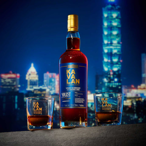 Kavalan Solist Vinho Barrique with glasses against the Taipei skyline