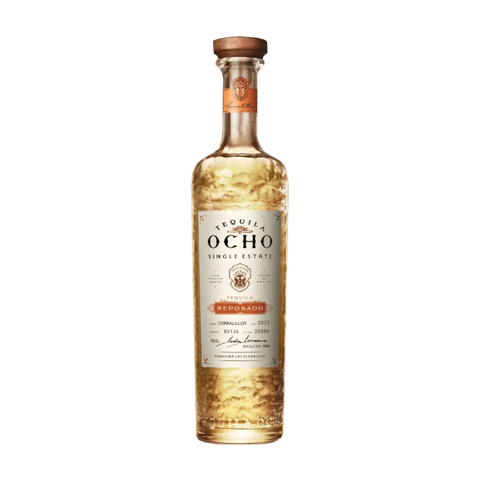 Bottle of Tequila Ocho Reposado against neutral background.